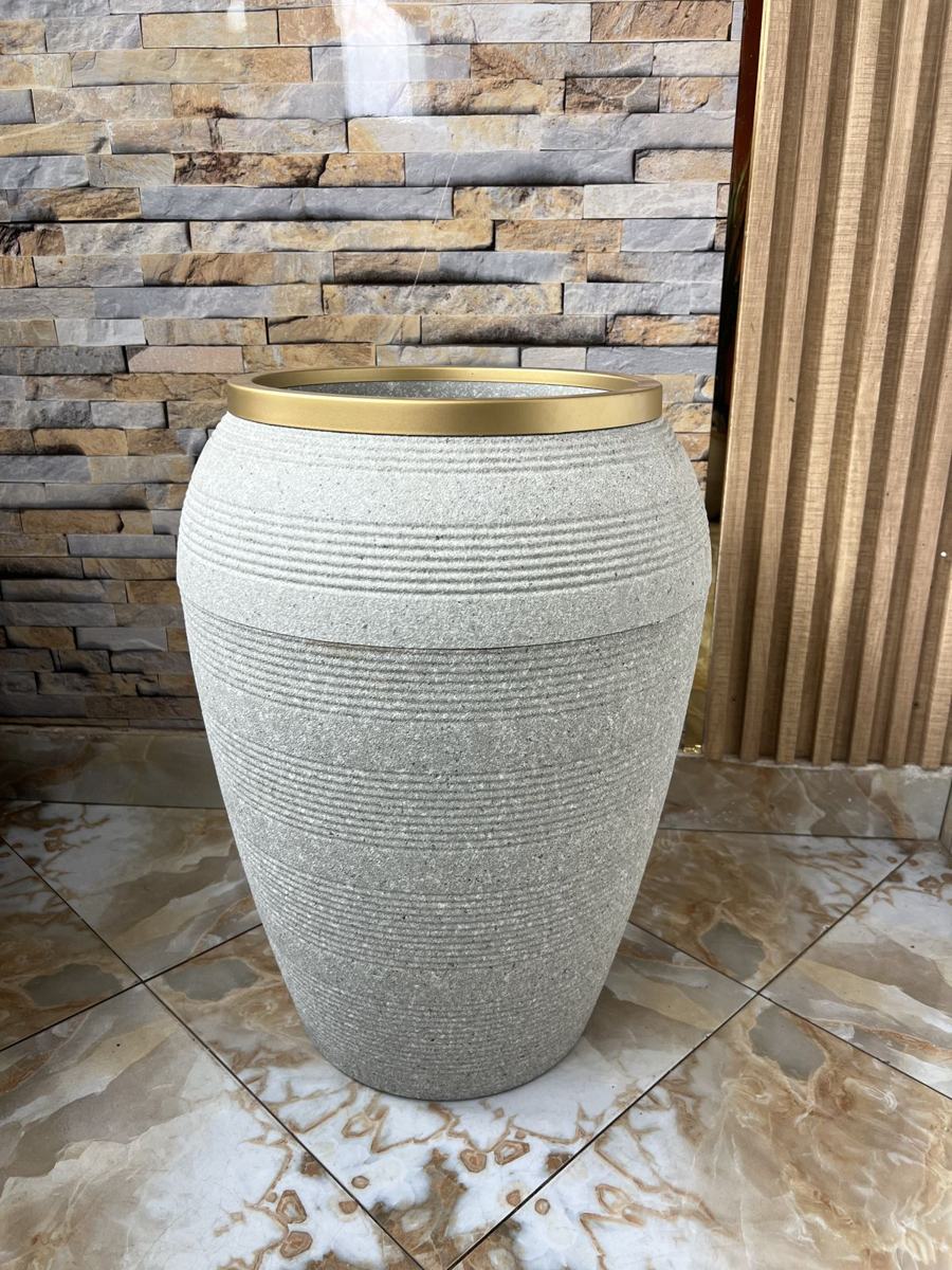 Stone-textured urn planter with gold rim